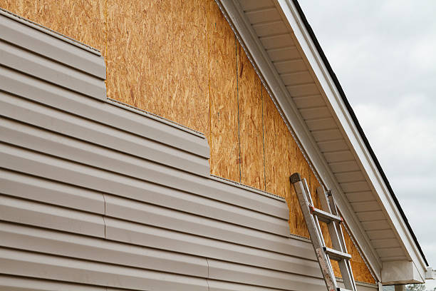 Professional Siding Replacement technician working in Raleigh, NC